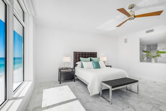 bedroom featuring marble finish floor, visible vents, and a ceiling fan