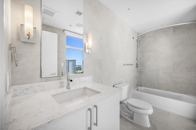 full bath with tile walls, shower / bathtub combination, visible vents, toilet, and tile patterned floors