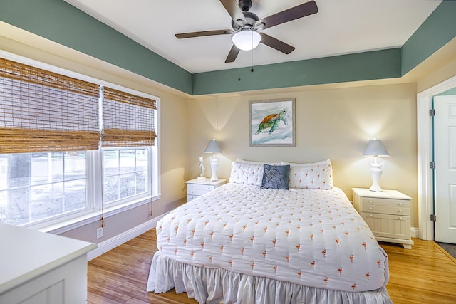 86 Village Blvd Apt 411, Santa Rosa Beach, FL 32459 - bedroom with a ceiling fan, baseboards, and light wood finished floors