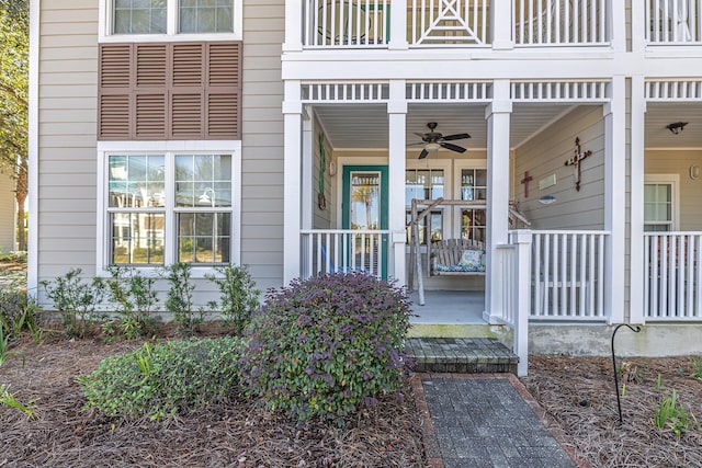 view of exterior entry featuring ceiling fan