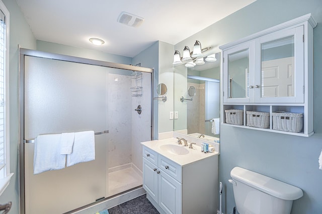 86 Village Blvd Apt 411, Santa Rosa Beach, FL 32459 - full bathroom featuring visible vents, toilet, a stall shower, and vanity