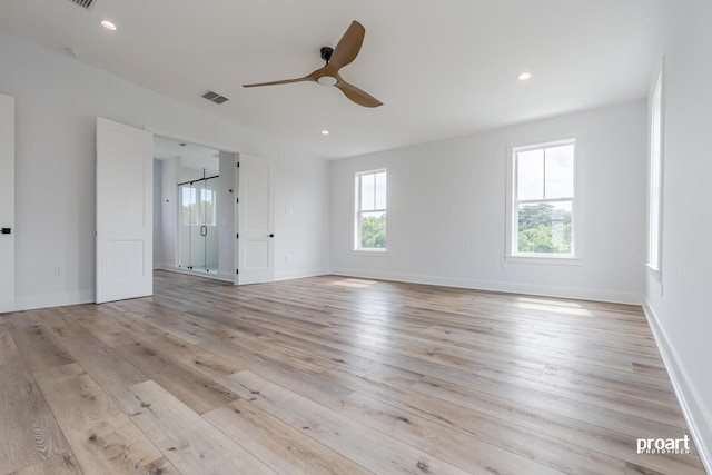 unfurnished room featuring light hardwood / wood-style flooring and ceiling fan