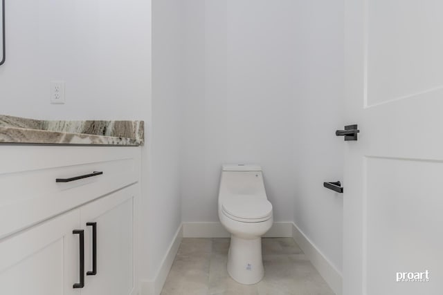 bathroom with tile patterned floors and toilet