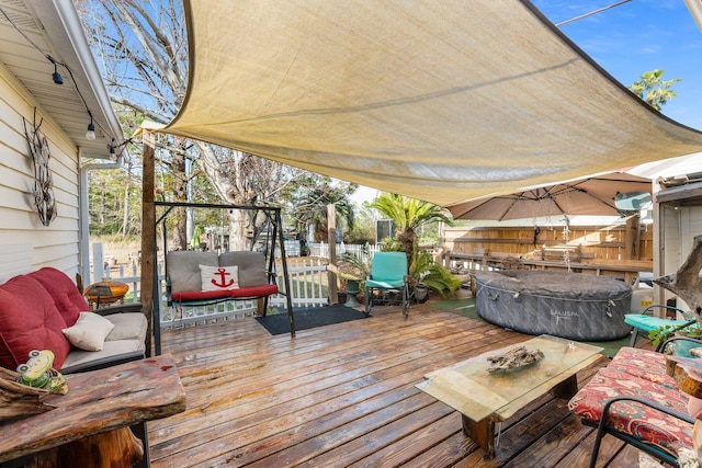 wooden terrace featuring a hot tub