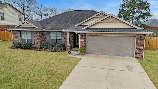 view of front of house featuring a garage and a front yard