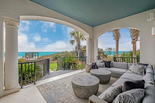 view of patio featuring outdoor lounge area and a water view