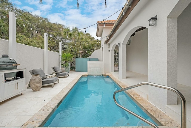 view of pool with a fenced in pool, a patio, and fence