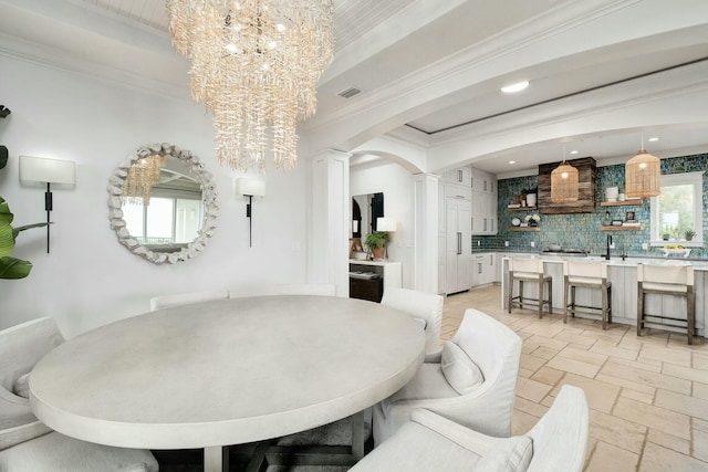 dining area with visible vents, an inviting chandelier, arched walkways, ornamental molding, and stone tile flooring