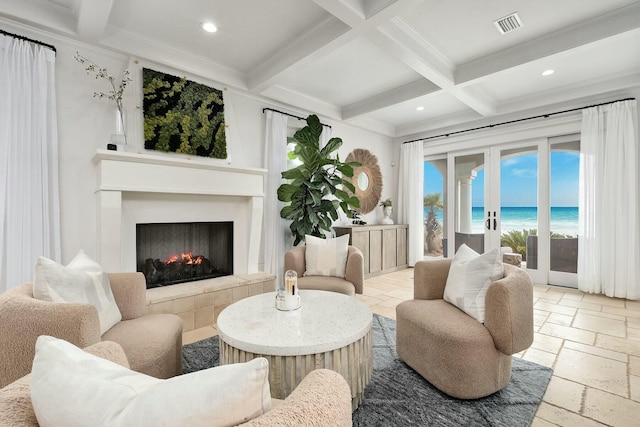 living area featuring recessed lighting, beamed ceiling, coffered ceiling, and stone tile floors