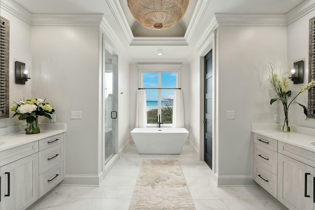 bathroom featuring vanity, a freestanding tub, a stall shower, ornamental molding, and marble finish floor