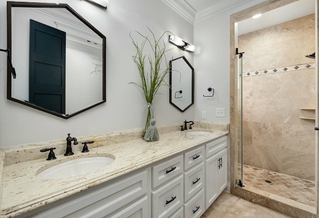 full bath with crown molding, double vanity, a shower stall, and a sink