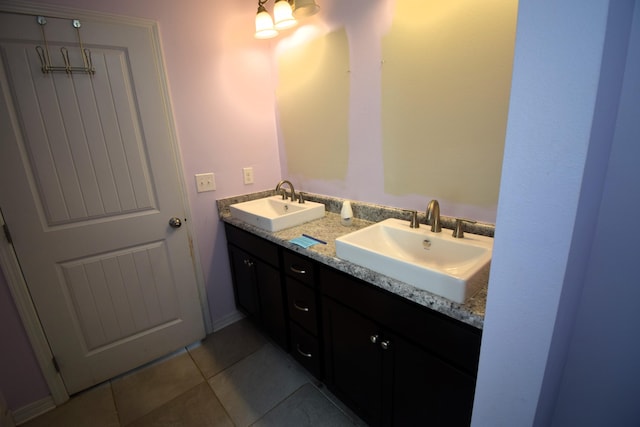 bathroom with tile patterned flooring and vanity