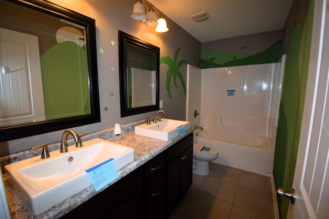 full bathroom featuring washtub / shower combination, vanity, toilet, and tile patterned flooring