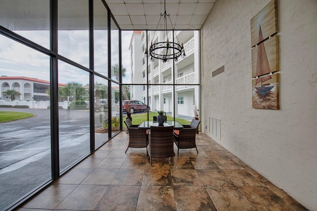 909 Santa Rosa Blvd Unit 611, Fort Walton Beach, FL 32548 - sunroom featuring a drop ceiling and a notable chandelier