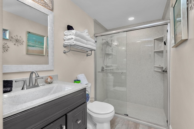 909 Santa Rosa Blvd Unit 611, Fort Walton Beach, FL 32548 - full bathroom with wood finished floors, a stall shower, vanity, and toilet