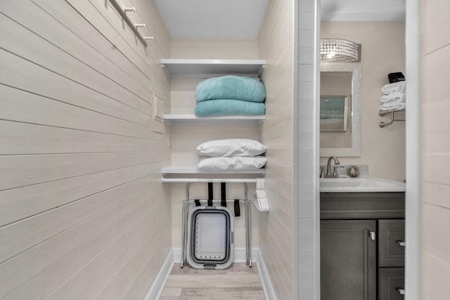909 Santa Rosa Blvd Unit 611, Fort Walton Beach, FL 32548 - bathroom featuring wood finished floors and vanity