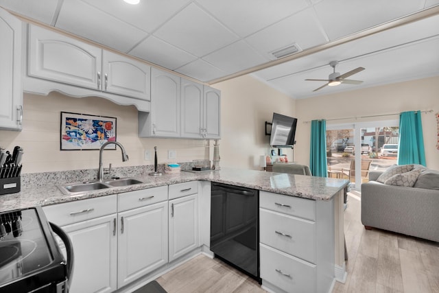 909 Santa Rosa Blvd Unit 611, Fort Walton Beach, FL 32548 - kitchen featuring open floor plan, electric range oven, a sink, and white cabinetry