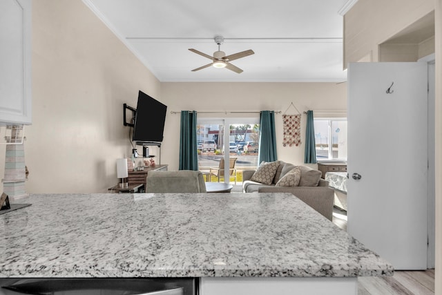 909 Santa Rosa Blvd Unit 611, Fort Walton Beach, FL 32548 - kitchen featuring ornamental molding, light wood-type flooring, open floor plan, and white cabinetry