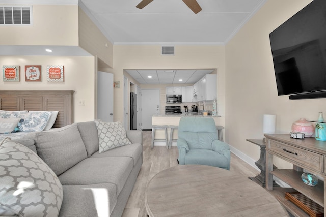 909 Santa Rosa Blvd Unit 611, Fort Walton Beach, FL 32548 - living room featuring ceiling fan, visible vents, light wood-style flooring, and ornamental molding