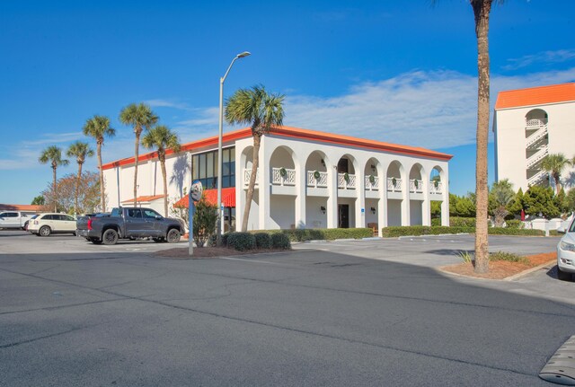 909 Santa Rosa Blvd Unit 611, Fort Walton Beach, FL 32548 - view of building exterior with uncovered parking