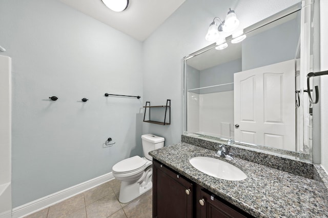 bathroom with vanity, tile patterned floors, and toilet