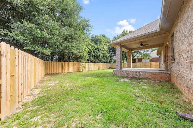 view of yard featuring ceiling fan