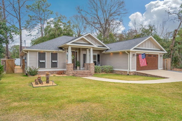 view of front of house with a garage and a front lawn