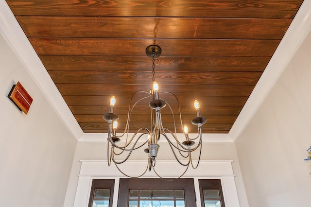 room details featuring wooden ceiling and an inviting chandelier