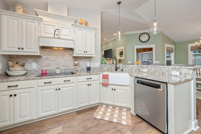 kitchen with sink, dishwasher, white cabinetry, black electric cooktop, and decorative light fixtures