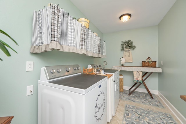 laundry room with washing machine and clothes dryer