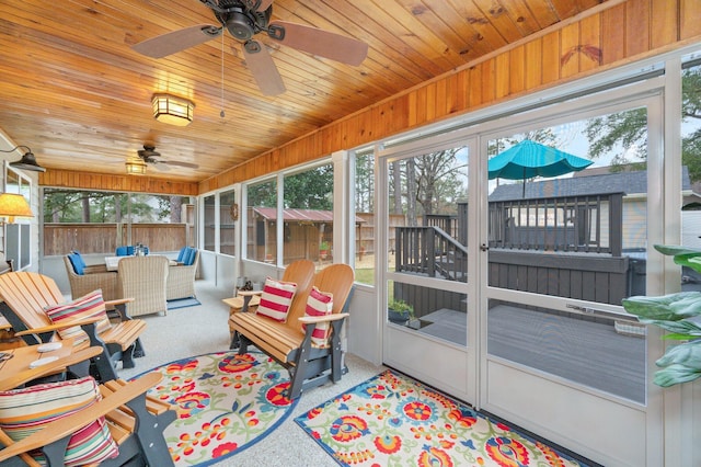 sunroom / solarium featuring wooden ceiling