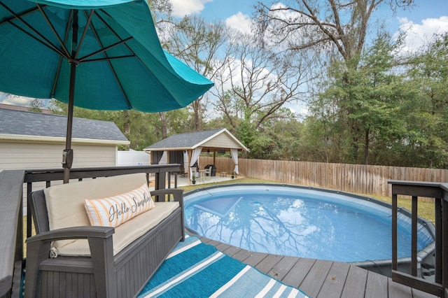 view of pool featuring a gazebo, an outdoor hangout area, and a wooden deck