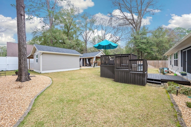 view of yard with an outdoor structure and a deck