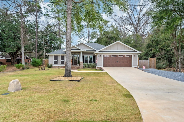 view of front of property featuring a garage and a front lawn