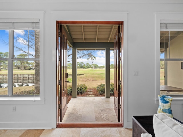 entrance foyer featuring a water view