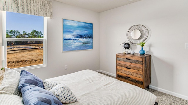 carpeted bedroom with baseboards