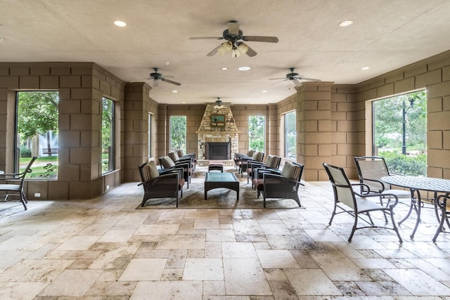 interior space with an outdoor stone fireplace