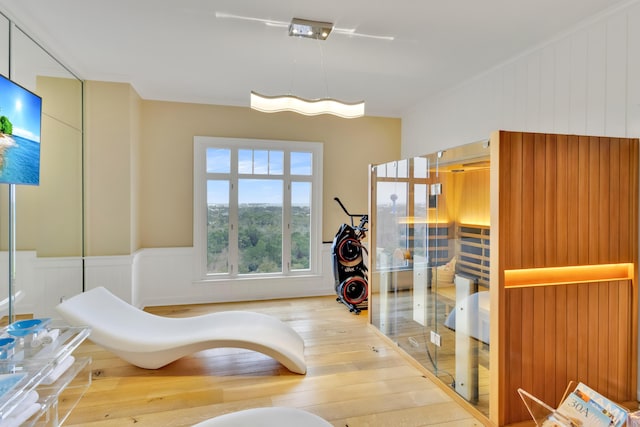 bathroom with ornamental molding and hardwood / wood-style flooring