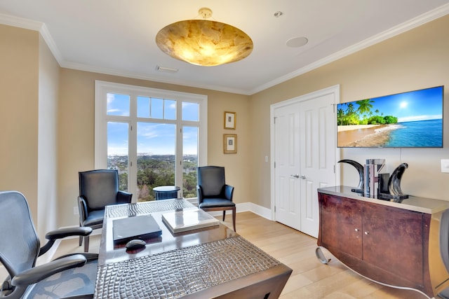 office space with light hardwood / wood-style floors and ornamental molding