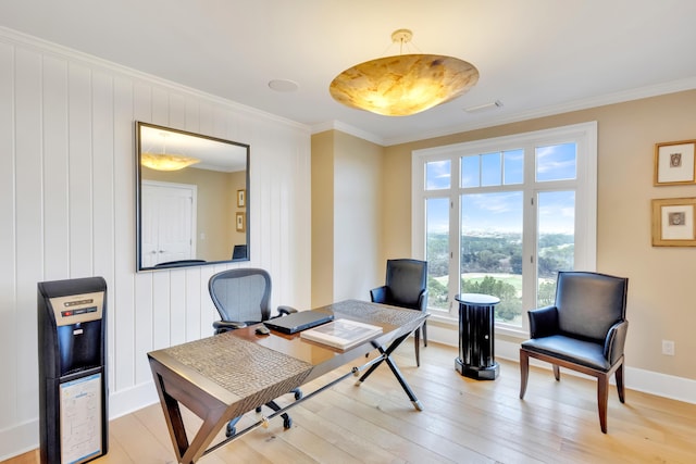 office featuring crown molding and light hardwood / wood-style floors