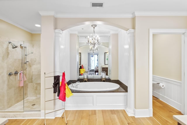 bathroom featuring shower with separate bathtub, crown molding, and wood-type flooring