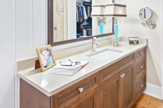 bathroom featuring vanity and wood-type flooring