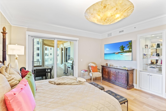 bedroom with light hardwood / wood-style flooring, crown molding, and access to exterior