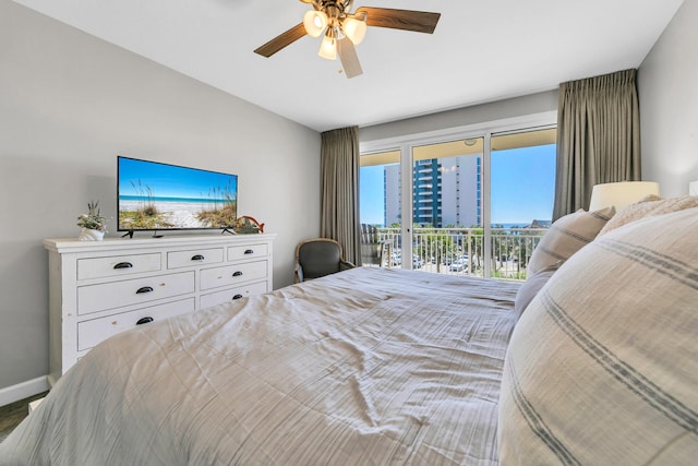 bedroom featuring access to exterior, baseboards, and a ceiling fan