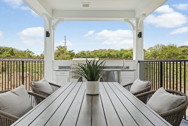 balcony featuring exterior kitchen