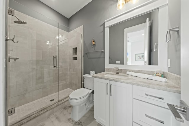 bathroom with vanity, toilet, and walk in shower