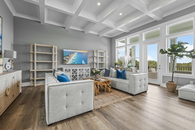 living room featuring beamed ceiling, crown molding, coffered ceiling, and hardwood / wood-style floors