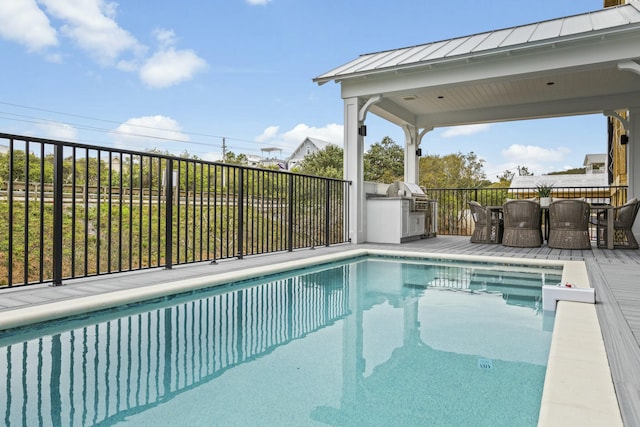 view of swimming pool featuring a wooden deck