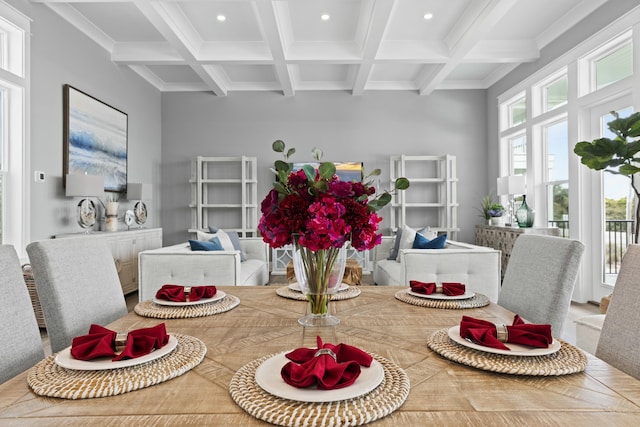 dining area with coffered ceiling, beam ceiling, and ornamental molding