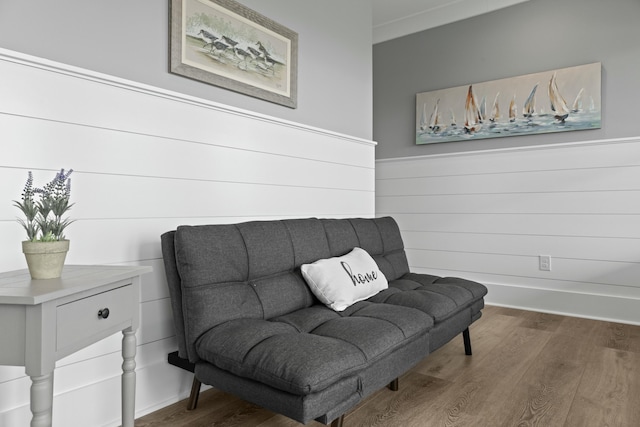 sitting room with wood-type flooring